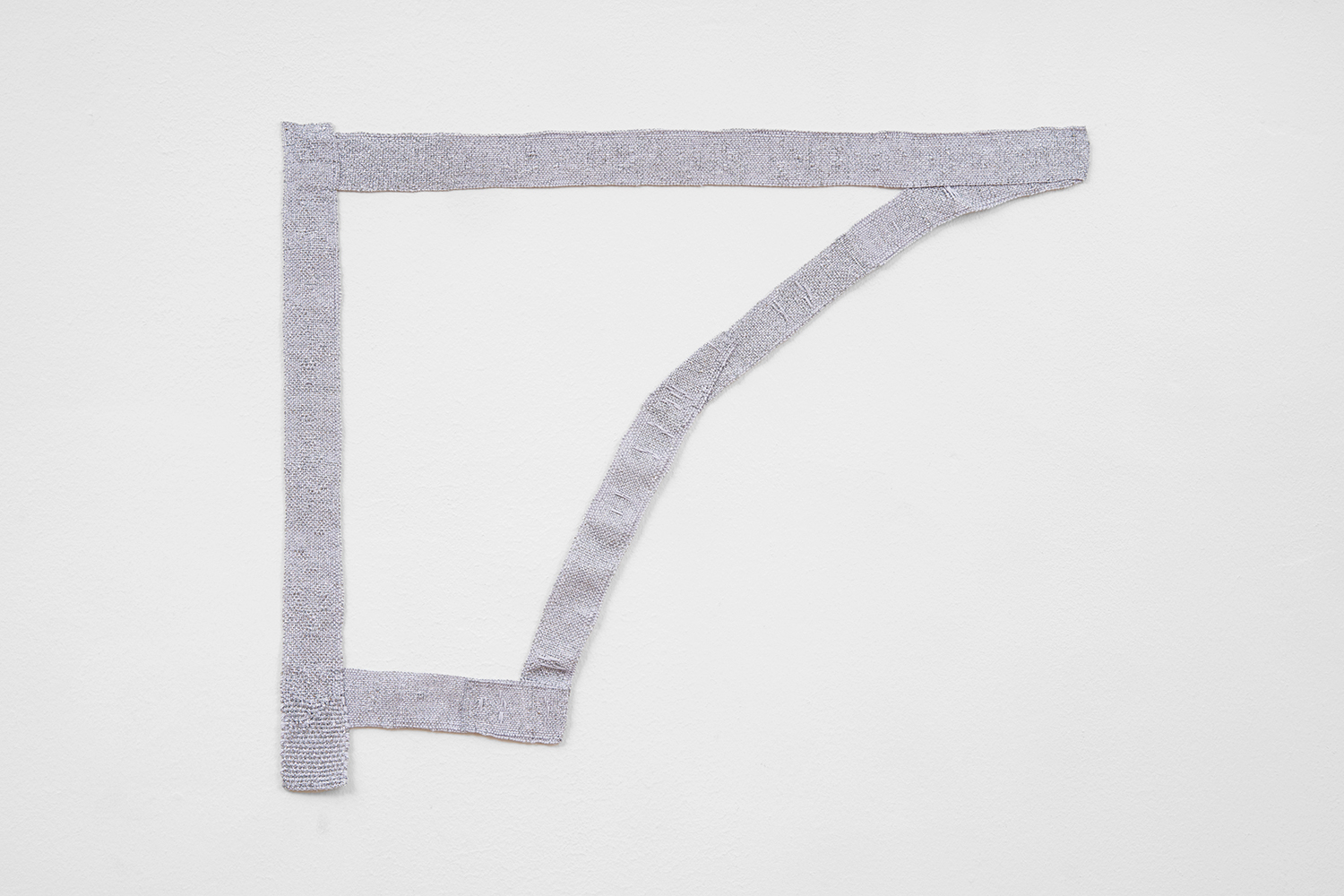 Hana Miletić, Materials, 2022, Handwoven textile (pale grey paper yarn, and silver metal yarn), 18 1/2 x 22 7/16 x 3/16 in.