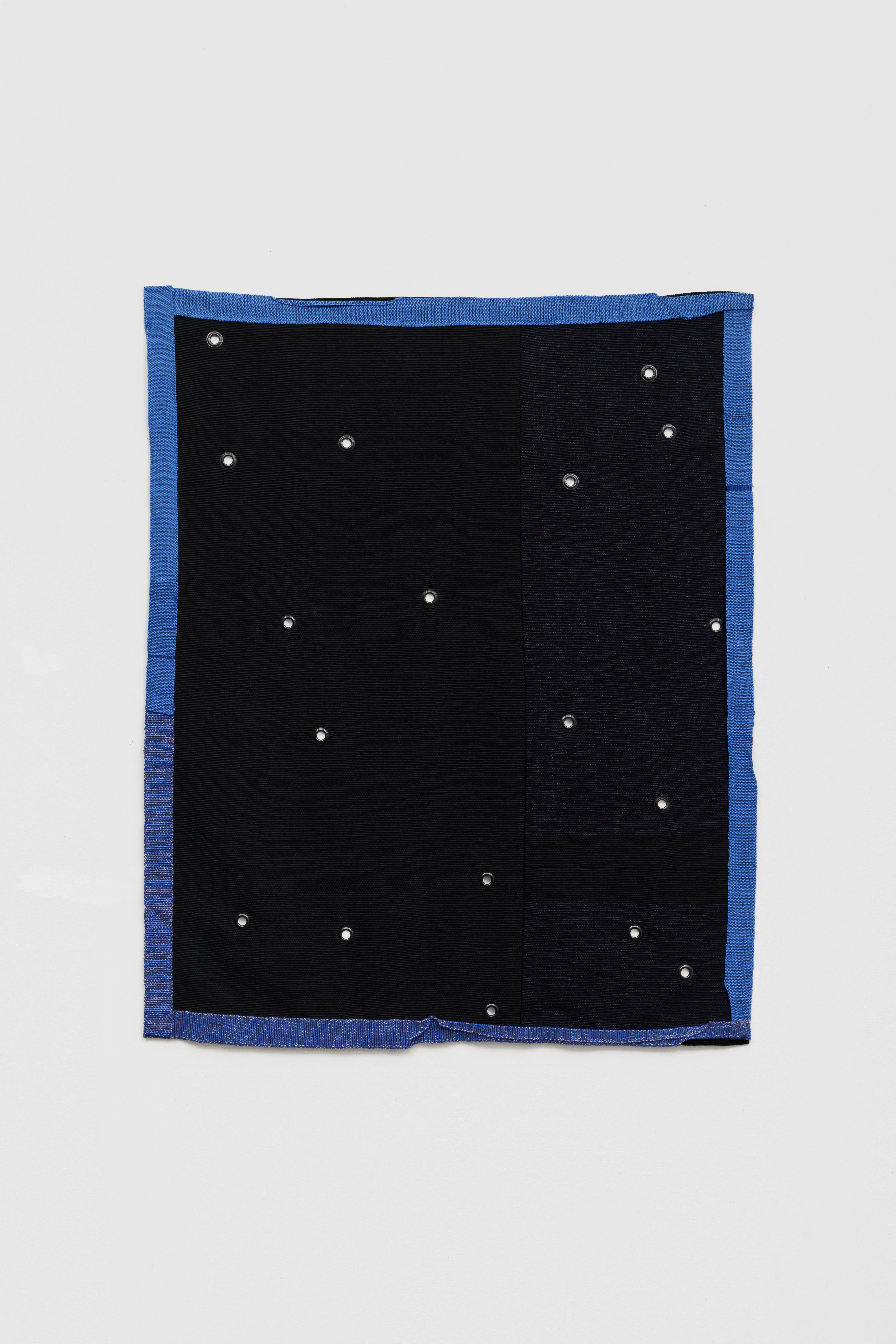 Hana Miletić, Materials, 2025, Hand-woven textile with metal eyelets (azure blue peace silk, black cottolin, blue-black cottolin, cobalt blue organic cotton, cobalt blue repurposed polyester, and navy blue mercerised cotton), 43 5/16 x 33 7/16 x 1 3/16 in.