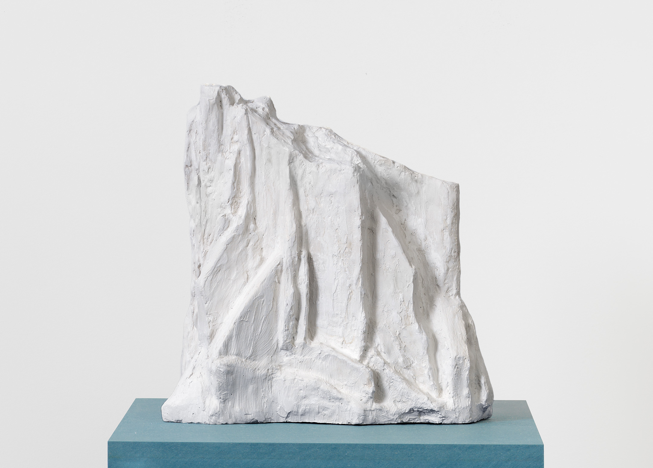 Jennifer Bolande, Drift 2, 2023, Plaster, wood, wire mesh on blue pigmented high-density composite plinth and base, 61 1/2 x 20 x 20 in.