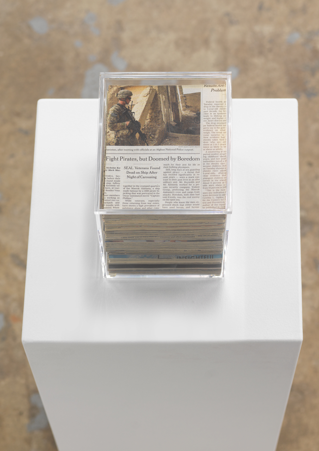 Jennifer Bolande, Excavation Core, 2017, Newspaper, plexiglass box, 7.50h x 7.50w x 6d in.