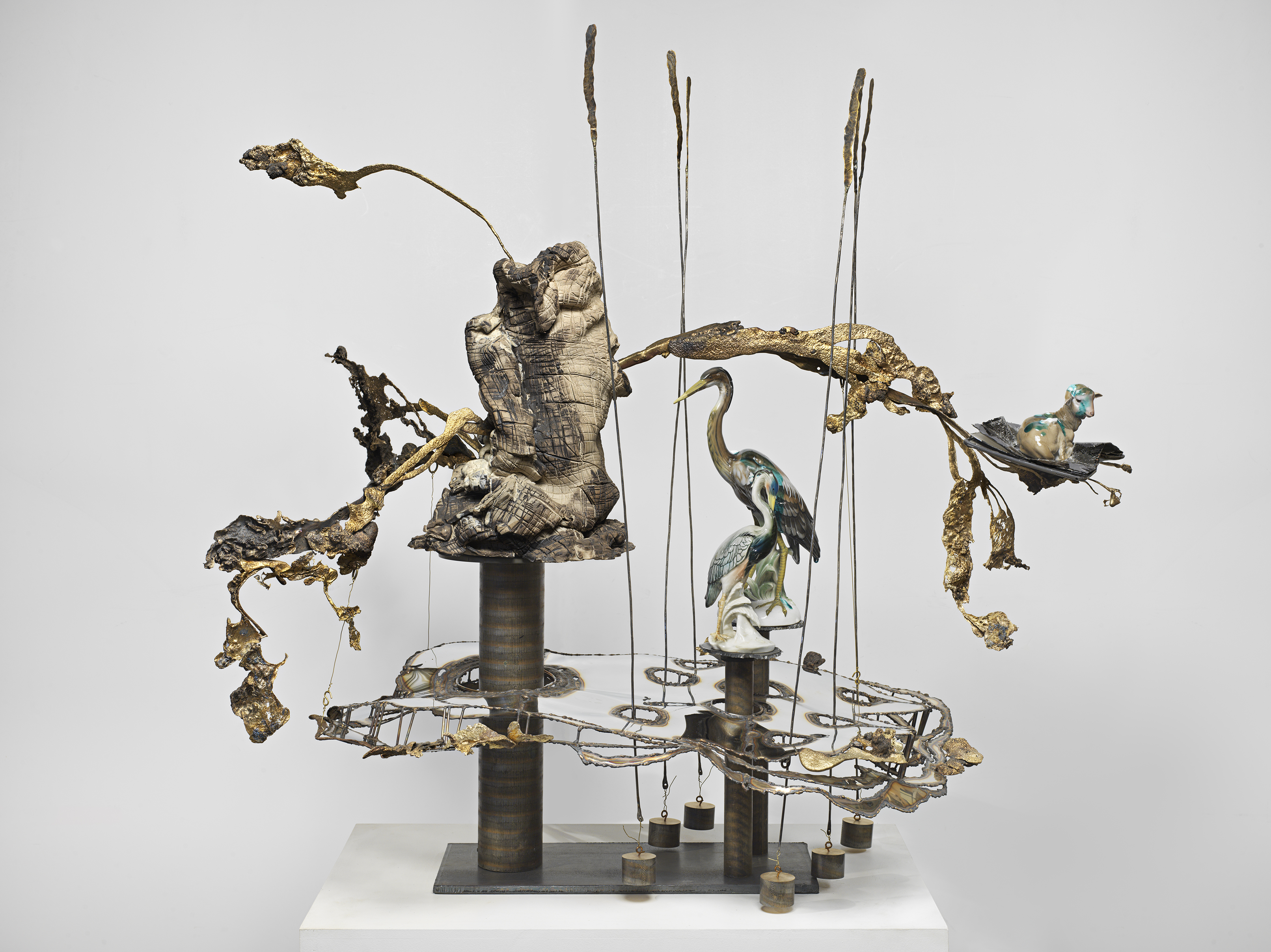 Jon Kessler, Scorched Earth II, 2024, Stainless steel, bronze, copper, glazed stoneware, iPad and porcelain figurines, 46 x 46 x 31 in.