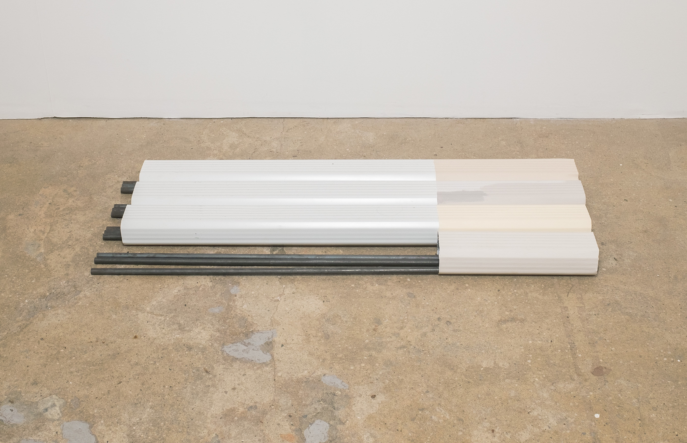 Linnea Kniaz, Surface Sequence 12, 2019, aluminum downspout, acrylic, and steel rod, 2h x 13w x 38d in.
