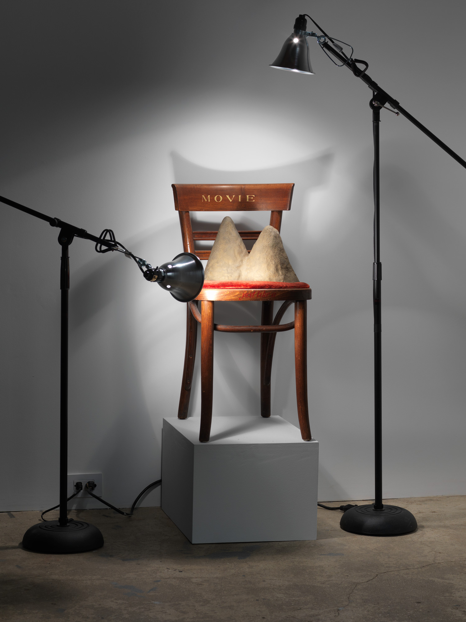 Jennifer Bolande, Movie Chair, 1984, wooden chair, velvet, bronze, enamel paint, light stands, lights, gaffer’s tape, 60h x 72w x 36d in.