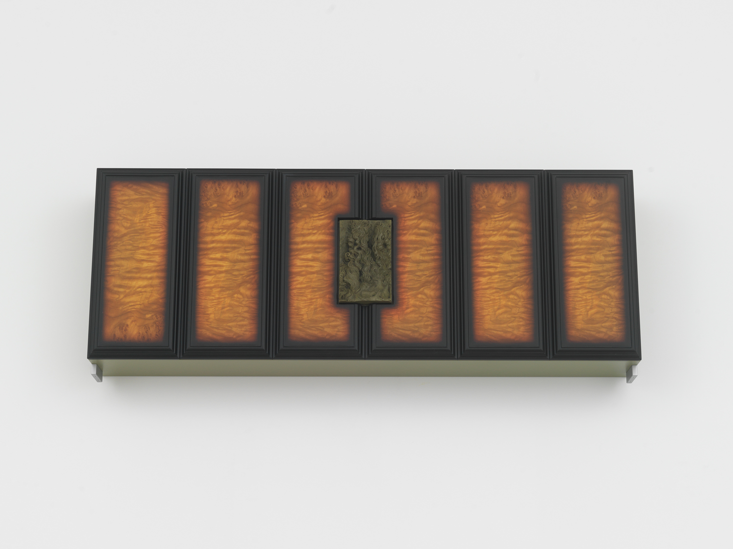 Philip Seibel, Gehäuse (Morgen), 2022, MDF, wood, found and altered wax relief, aluminum, stainless steel, 14 3/16 x 40 3/16 x 6 5/16 in.