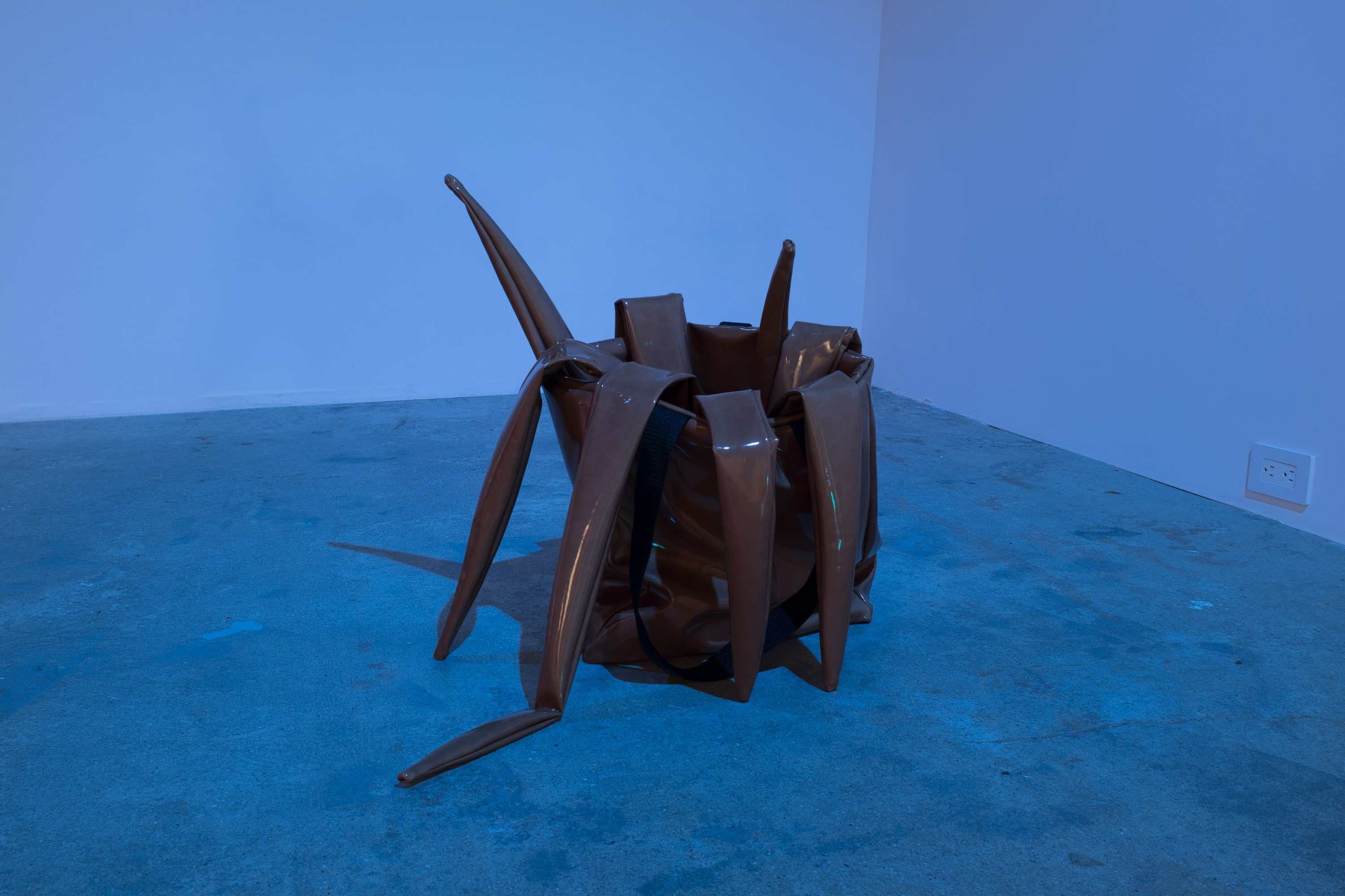 Sandra Mujinga, Octo Handbag, 2017, coated PVC rubber, nylon ribbon, 13.39h x 6.30w x 39.37d in.