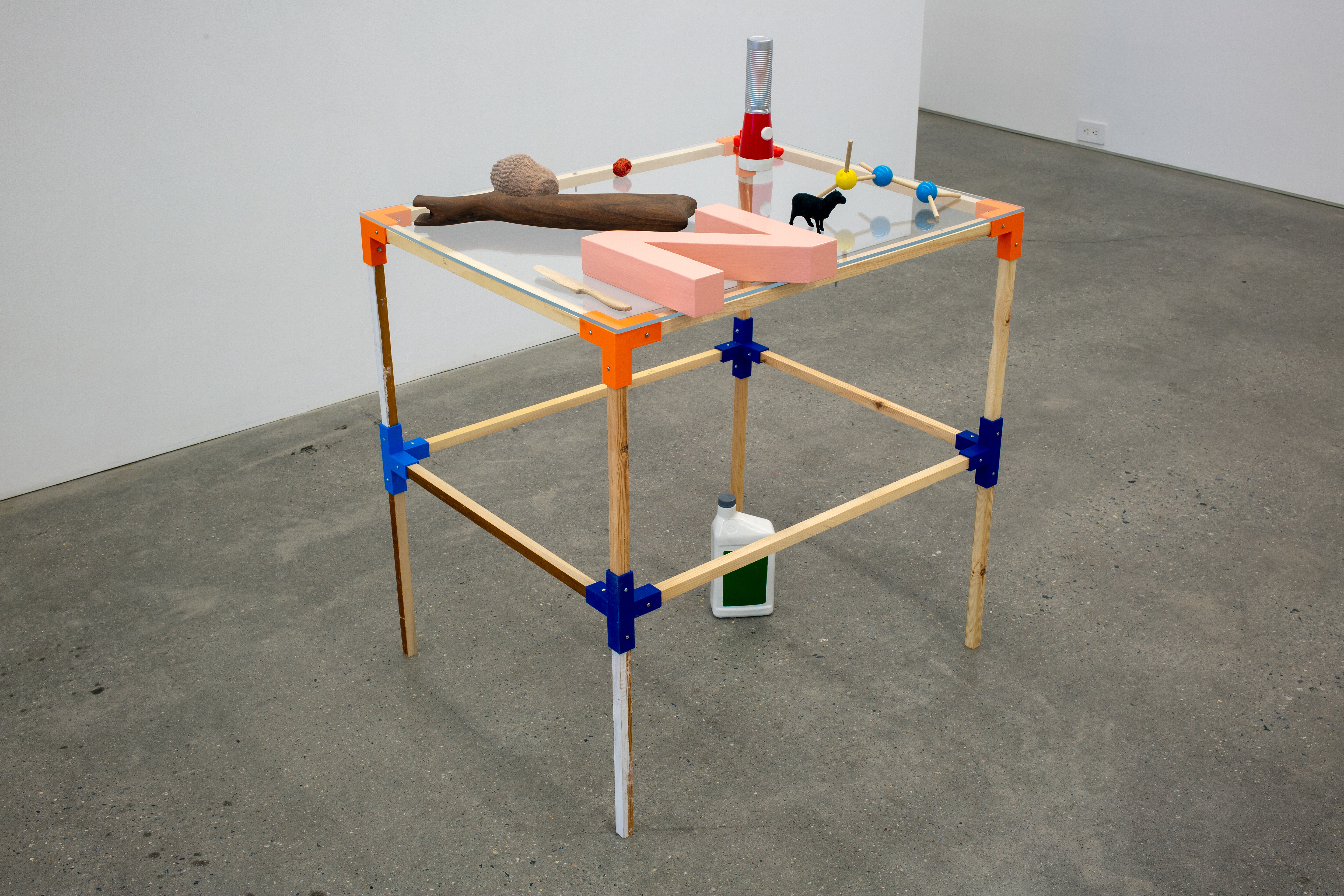 Maximilian Goldfarb, Transmitter: Small Object Array (Table I), 2021, Various handmade and fabricated objects on display table made of printed plastic connectors,, wood spans, hardware, plexi, 30h x 24w x 30d in.