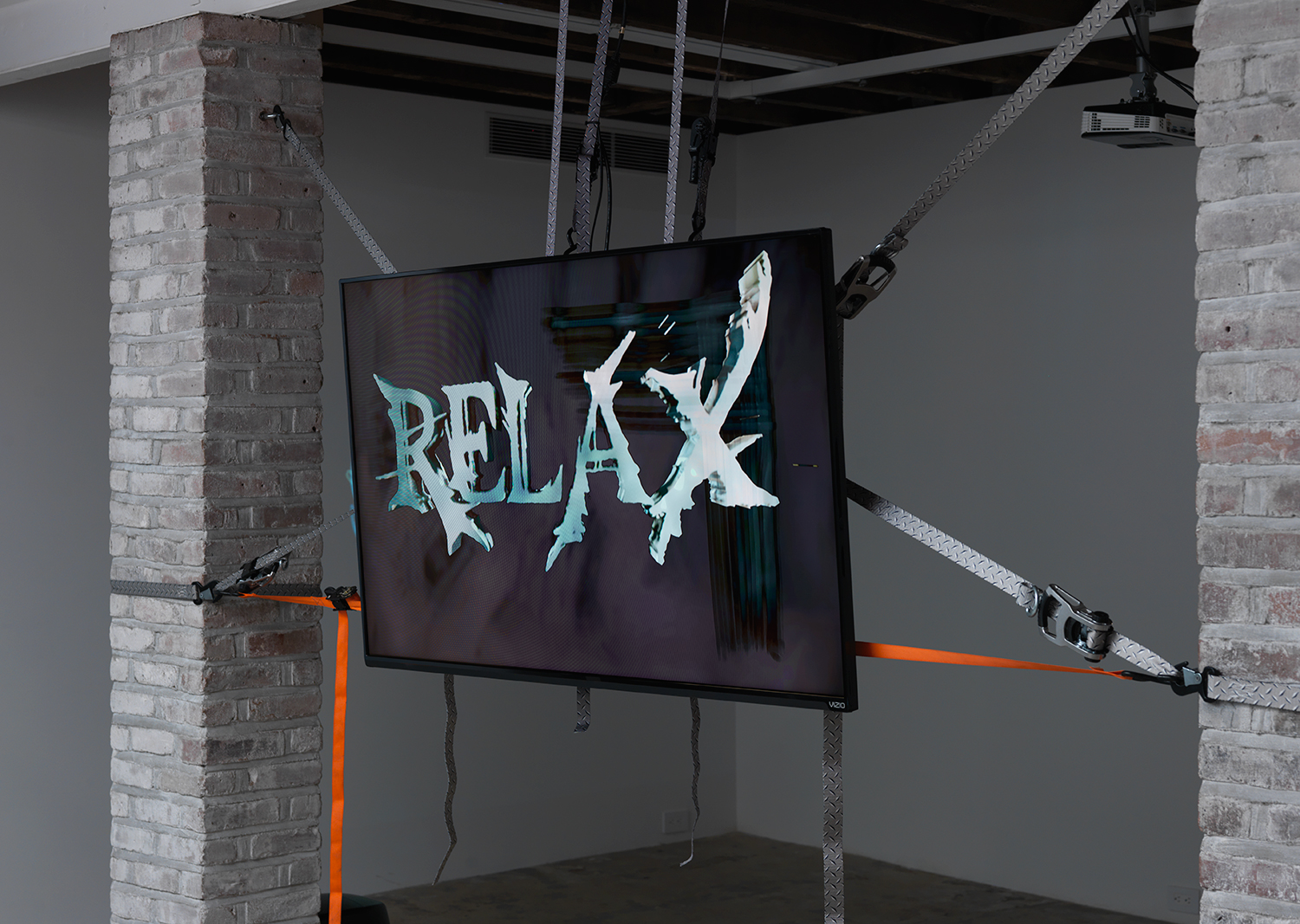 Theodore Darst, The Tourist: This Machine Makes Fascists (Soundtrack by Kevin Carey), 2017, 11 minute HD Video loop, cargo straps, mounting equipment, dimensions variable. Edition of 3 + 2 Artist Proofs.