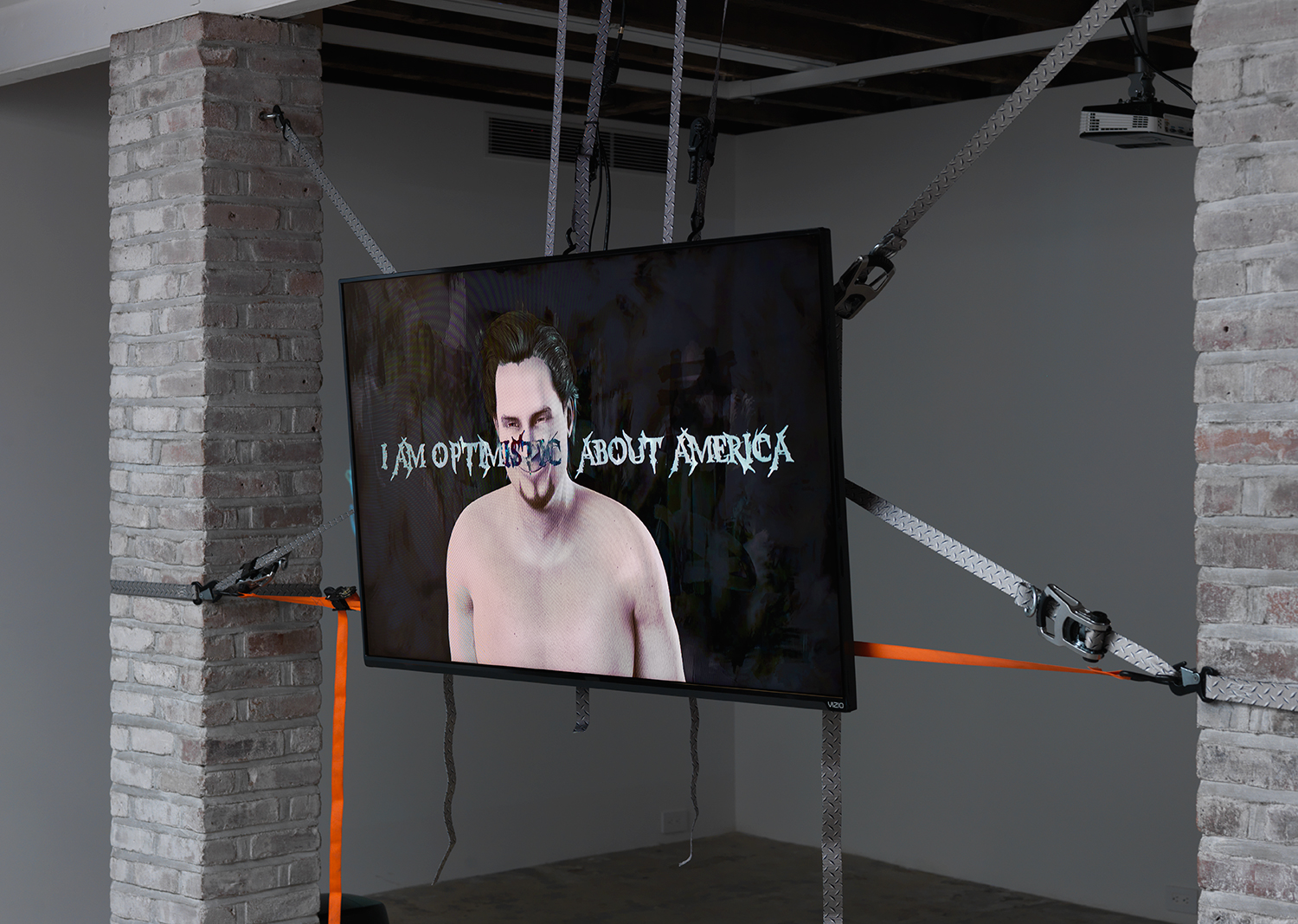Theodore Darst, The Tourist: This Machine Makes Fascists (Soundtrack by Kevin Carey), 2017, 11 minute HD Video loop, cargo straps, mounting equipment, dimensions variable. Edition of 3 + 2 Artist Proofs.